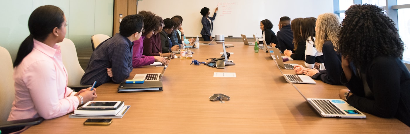 Business leaders meeting around a boardroom table